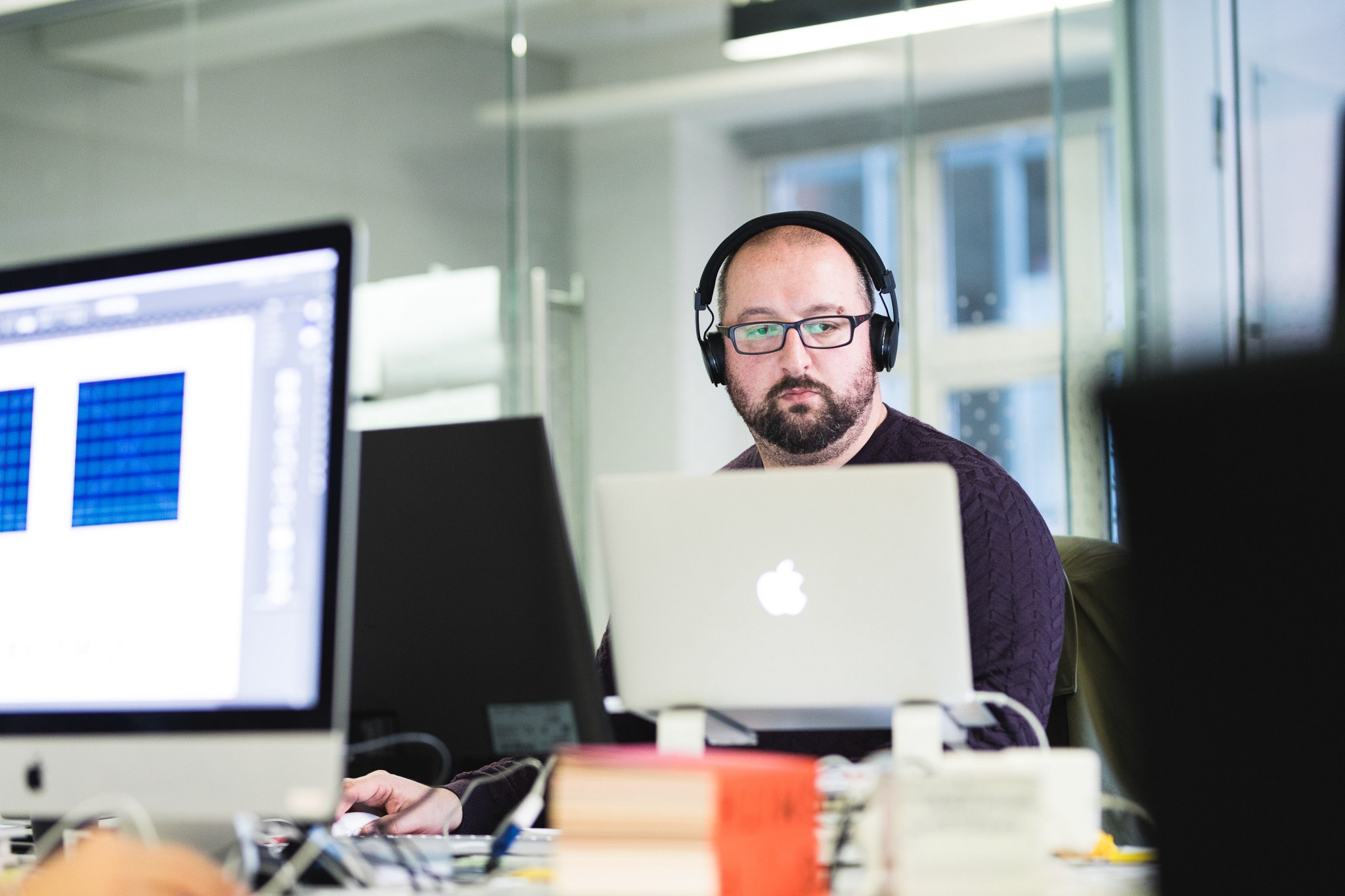 candid company portrait headphones macbook