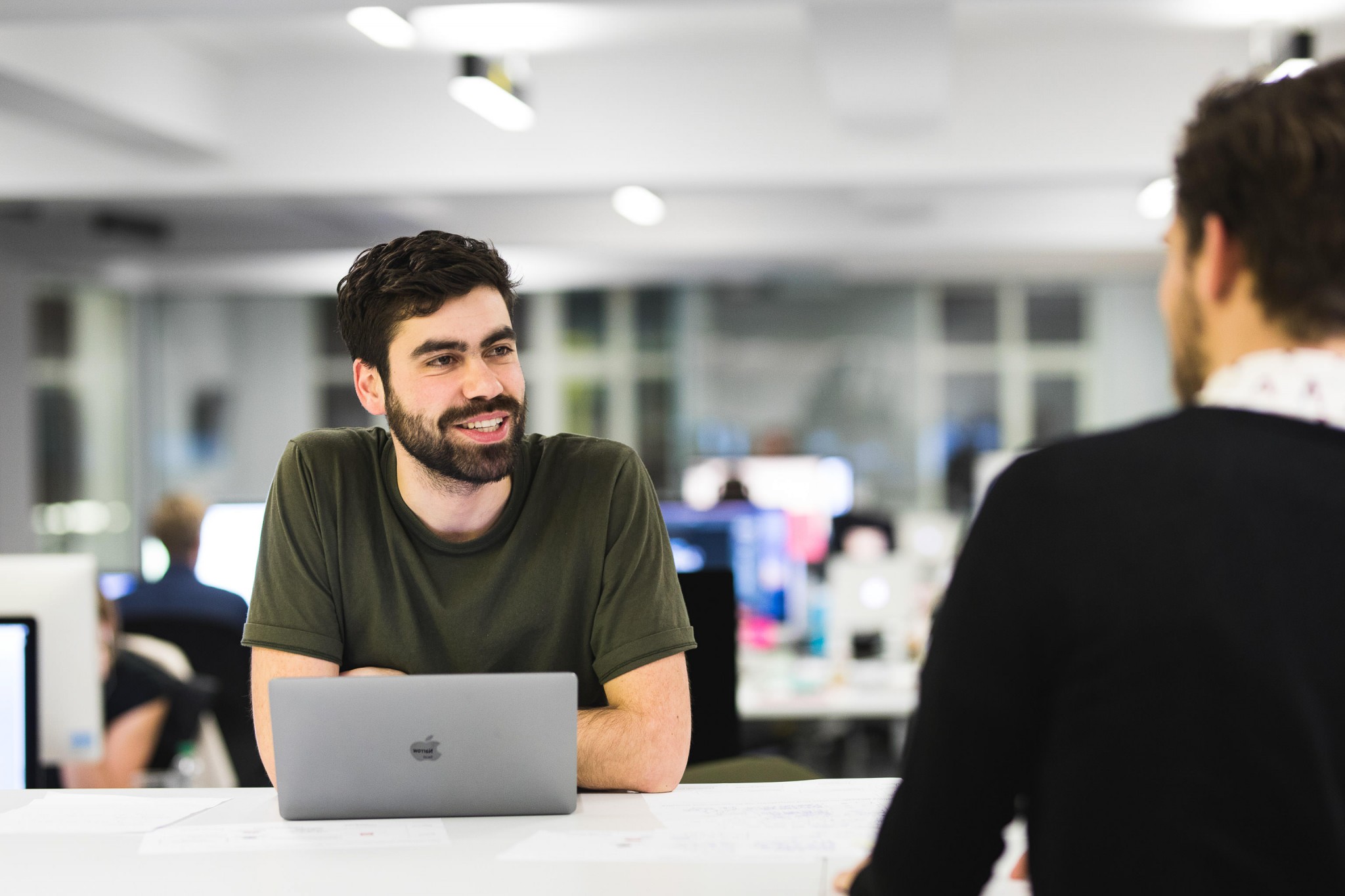 reportage company portrait young male beard macbook