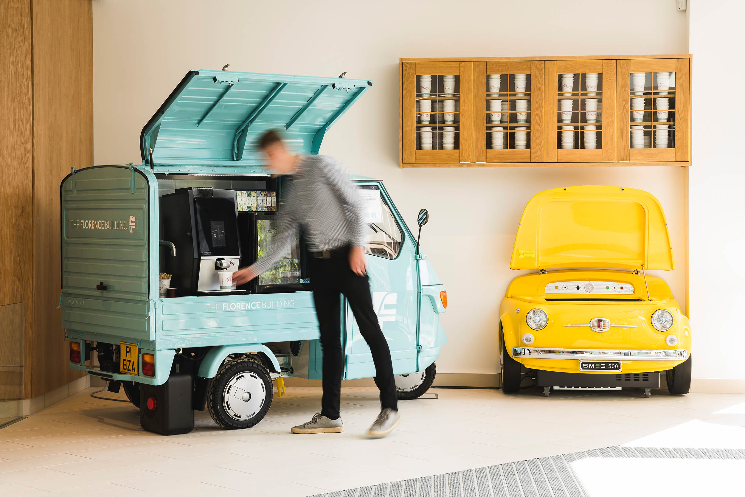 youngmangettingcoffeefromconvertedpiaggioapevan Chris Renton