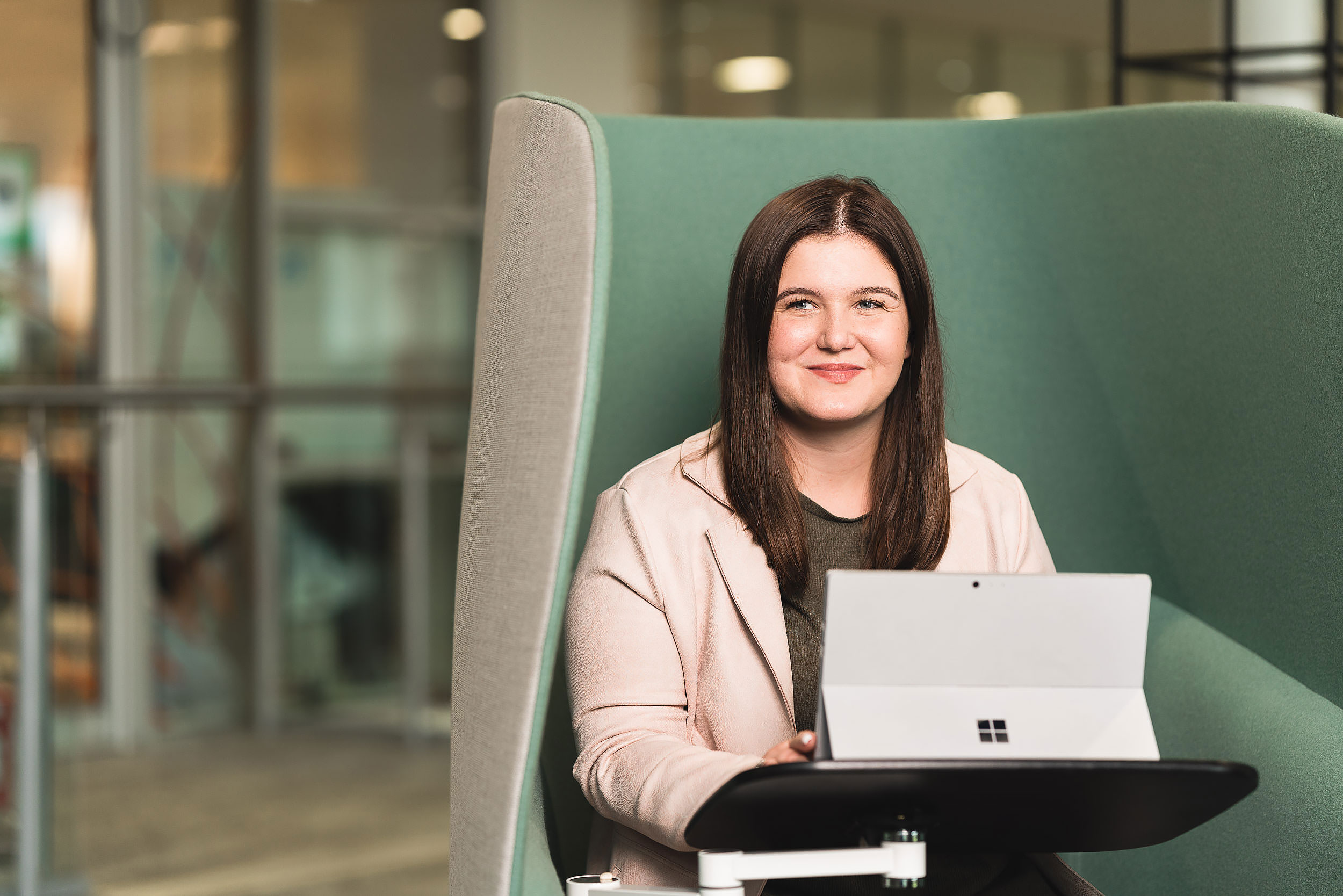 relaxed business portrait of female with laptop